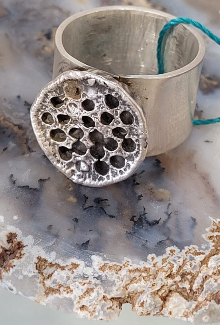 Image of a silver ring created by artist Kenna McCall.